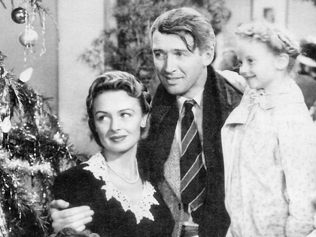 Screenshot of "It's a Wonderful Life" with Donna Reed, Jimmy Stewart and Karolyn Grimes (as Zuzu).