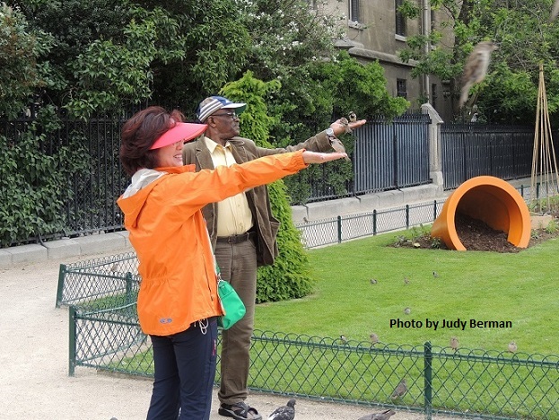 Feeding pigeons, next to the Cathedrale de Notre-Dame