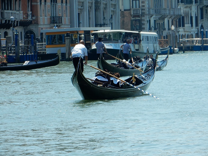 Venice - gondoliers and vaporetto on the Grand Canal